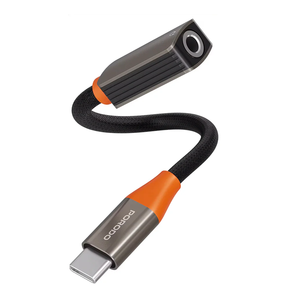 Enjoy high-quality audio wherever you go with the PORODO AudioLink USB-C to 3.5mm Audio Jack Adapter Black Orange PDETK16BKOG